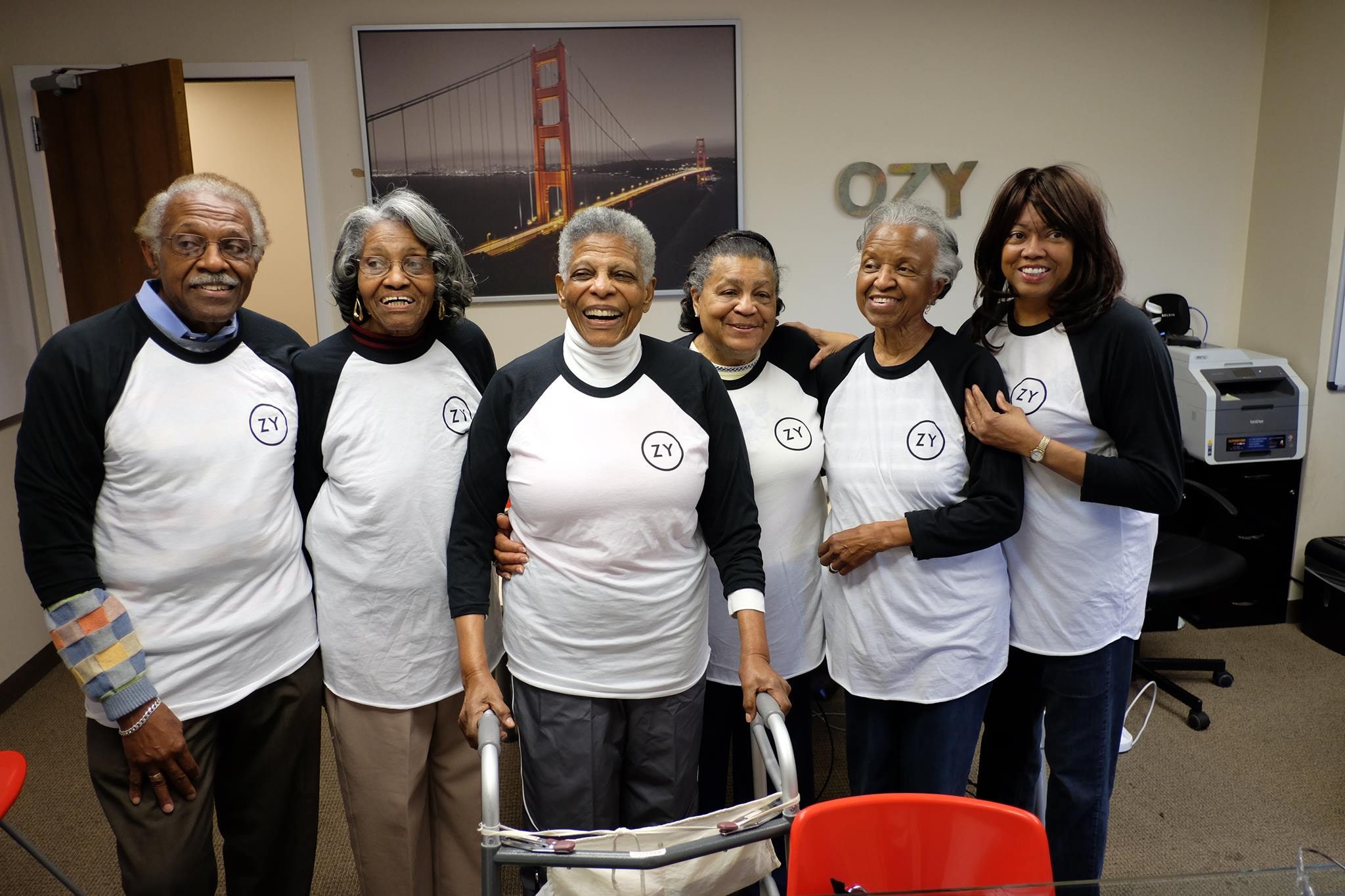 Carlos Watson’s mother and siblings in matching OZY shirts